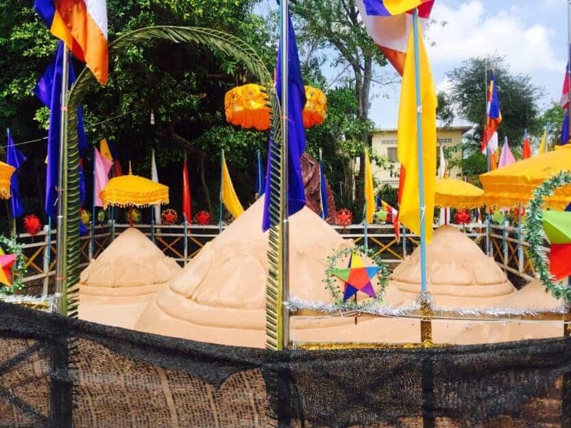 Sand Mountain at Wat Bo Pagoda for Khmer New Year in Siem Reap 2024 Sand mountain covered in red, yellow and blue flags and bunting at Wat Bo Pagoda for Khmer New Year in Siem Reap 2024