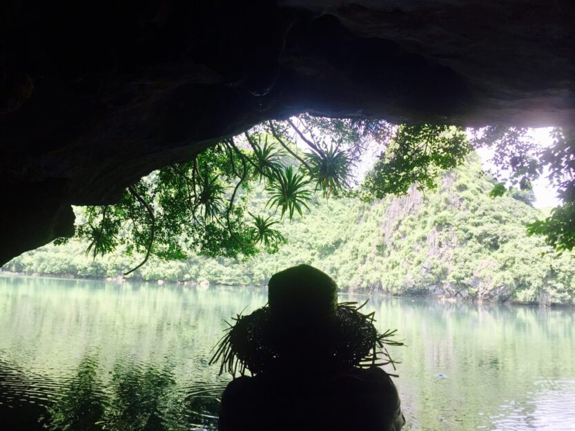 Dark Cave and its Lagoon in Bai Tu Long Bay, Vietnam Dark Cave and its Lagoon in Bai Tu Long Bay, Vietnam
