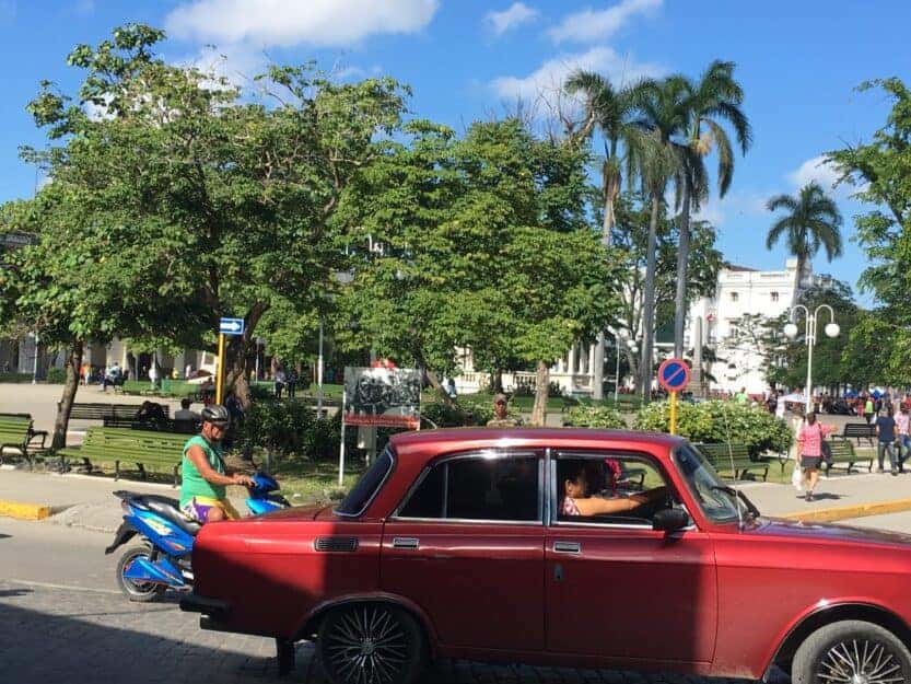 Santa Clara Cuba Santa Clara Cuba, plaza with old red car in the foreground.