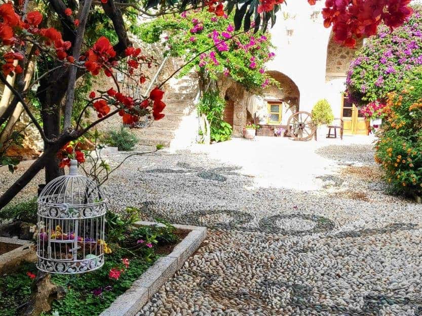 courtyard at Archontiko Hatzipanayioti Hotel in Leonidio Beautiful, flower-filled courtyard at Archontiko Hatzipanayioti Hotel in Leonidio, Peloponnese