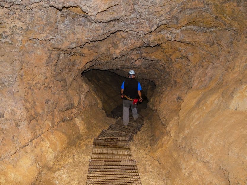 Cuevo del Viento, The Wind Cave Cueva del Viento, The Wind Cave. Image of man walking down cave tunnel.