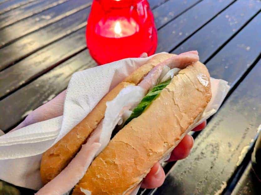 Fischbrötchen in Hamburg. Fischbrötchen in Hamburg. Herring cured in a soft white roll with lettuce, raw onion and pickles.