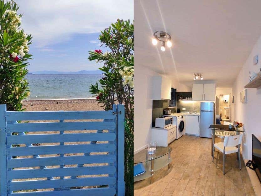 Hellenic Escapes Kantia Beachfront Studio. Hellenic Escapes Kantia Beachfront Studio. On left blue gate with Oleander plants with white and pink flowers either side. Dark yellow beach and sea in the background behind the gate. On the right is the interior of the studio apartment, a seating area with table and two chairs, a kitchen and in the background the end of a bed and bathroom entrance