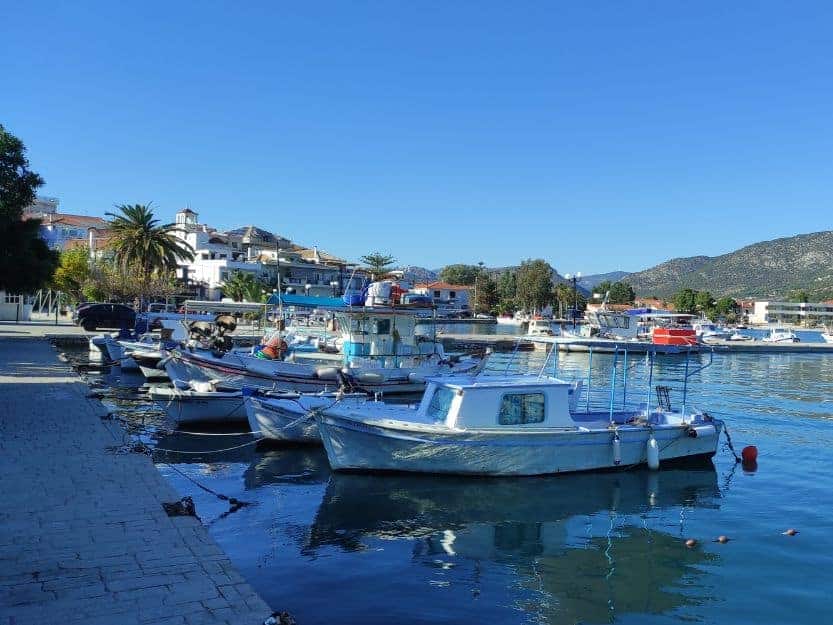 Limani, Ermioni, Greece Colourful boats moored lined up on Limani side of Ermioni Greece
