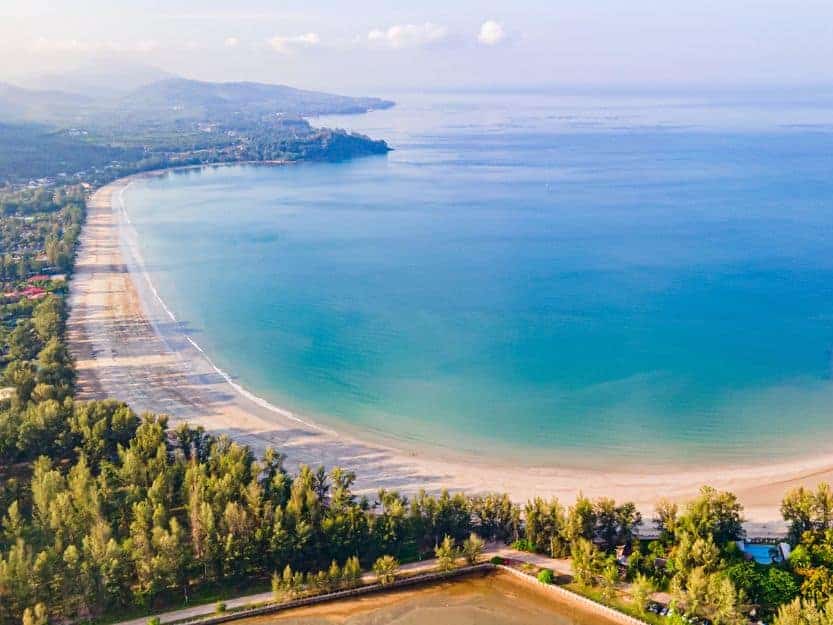 Long Beach on Koh Lanta Island in Thailand Long Beach on Koh Lanta. White sandy long strip of tree lined beach on the left with blue sea on the right.
