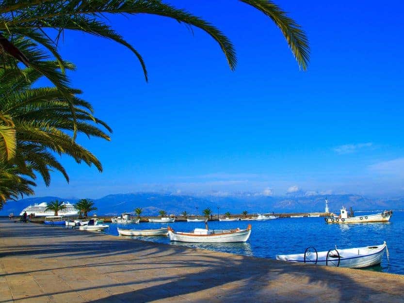 Nafplio Port Nafplio port lined with palm trees with boats on the water