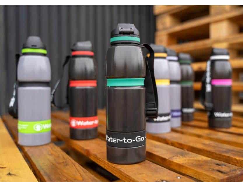 Customisable1 litre Water-to-Go filter water bottles with different colour bottles and bands.