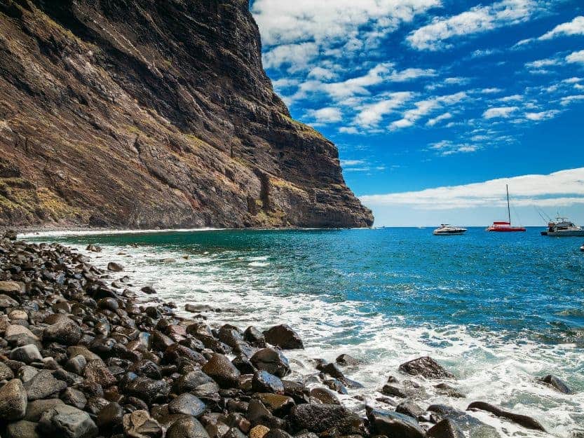 Playa de Masca, Tenerife Playa de Masca, Tenerife. Image of rocky beach and cliffs to left and blue sea and sky to the right