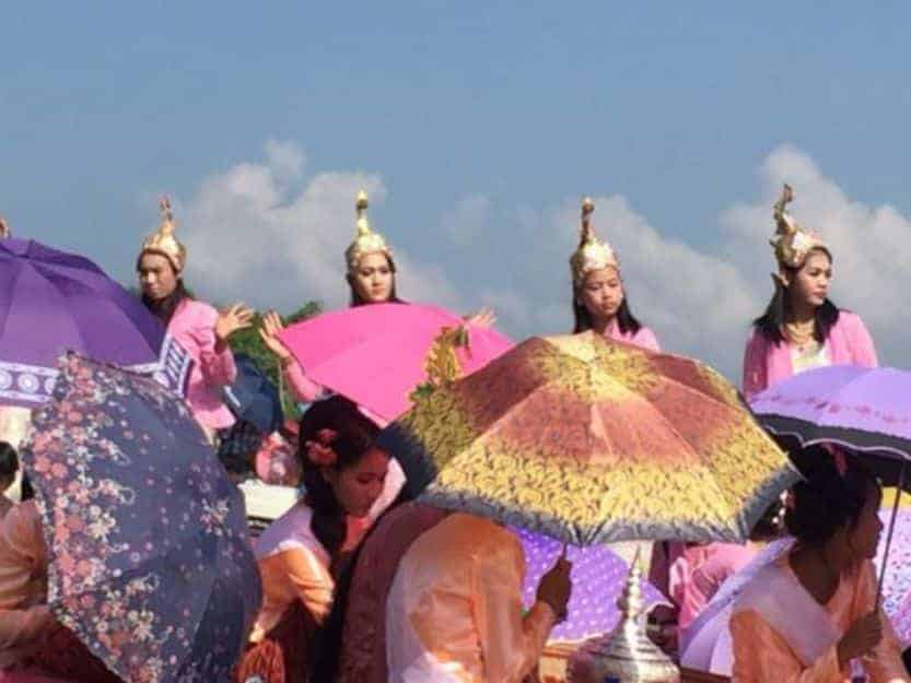 Shan dancers Paung Daw Oo Pagoda Festival Inle Lake Shan dancers Paung Daw Oo Pagoda Festival Inle Lake. Female dancers with purple and pink parasols and gold head dresses.