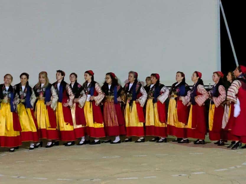 Tsakonian Cultural Show Tsakonian cultural show, women dancers dressed in red and yellow costumes.