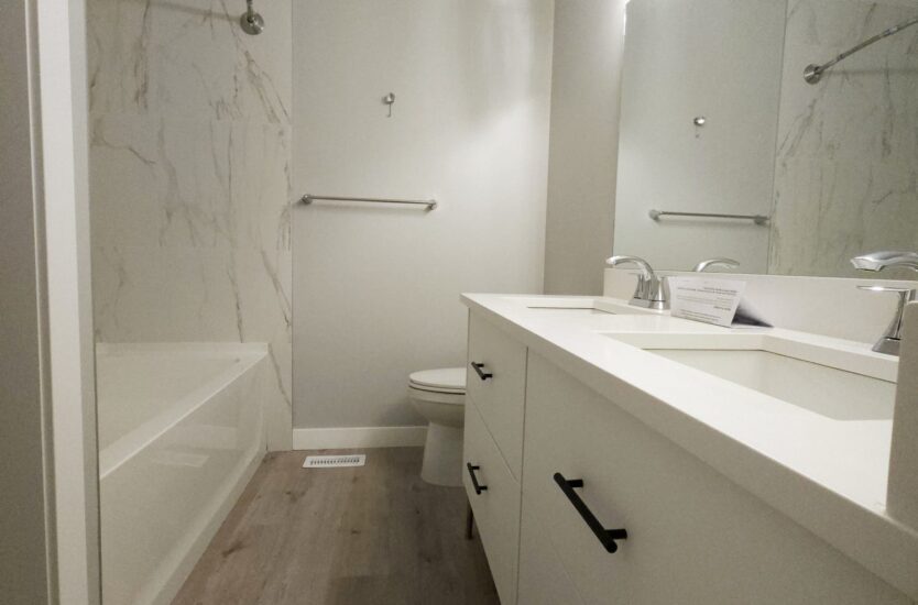 Remodelled bathroom with [walk-in glass shower, white subway tile, floating vanity] in Calgary