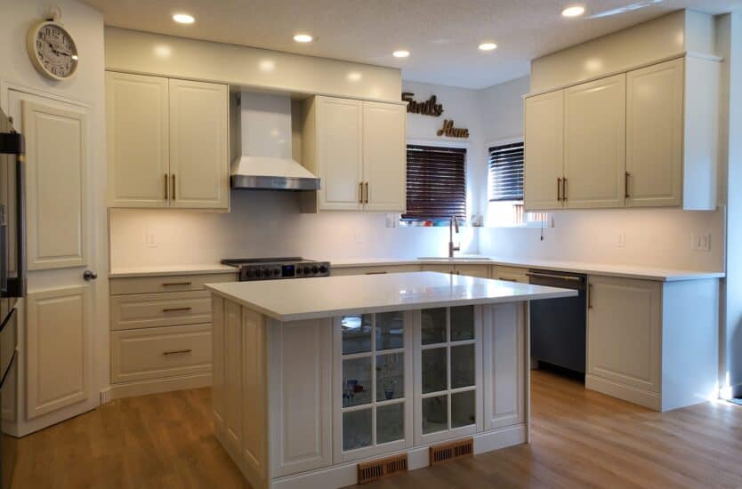 Modern Calgary kitchen renovation with [white shaker cabinets, quartz island, black hardware]