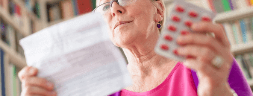 woman reading drug information