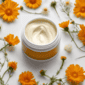 picture of a natural cream surrounded by calendula flowers