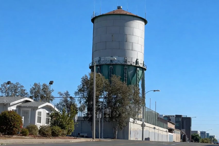 Historic North Park water tower in San Diego, California, photographed on a clear day above surrounding homes
