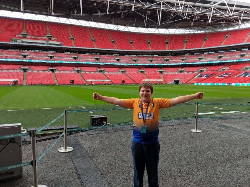Young boy stood by the pitch at Wembley Stadium