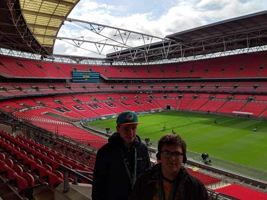 Two people standing in the stands of Wembley Stadium