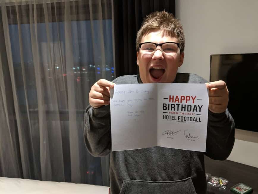 Ben holding a birthday card