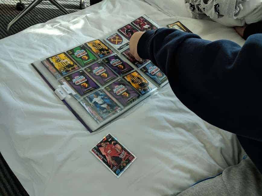 arm placing cards in a folder