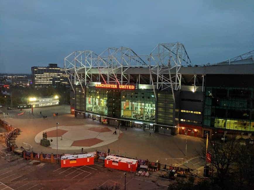 old trafford football club at night