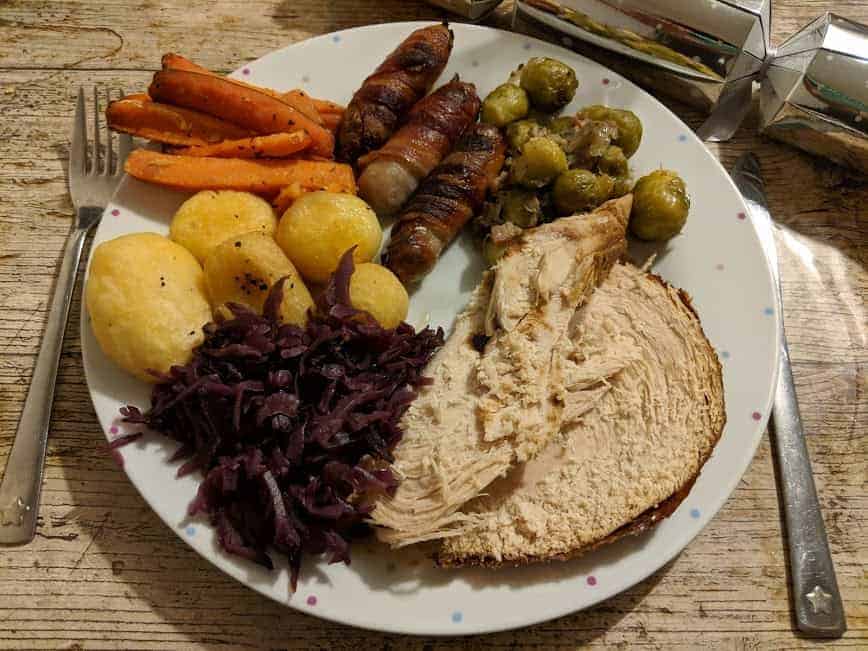 Plate of a turkey roast dinner including potatoes, red cabbage, sprouts and carrots from a Donald Russell Christmas box