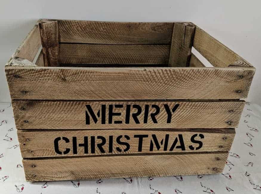Closeup of Merry Christmas vintage apple crate