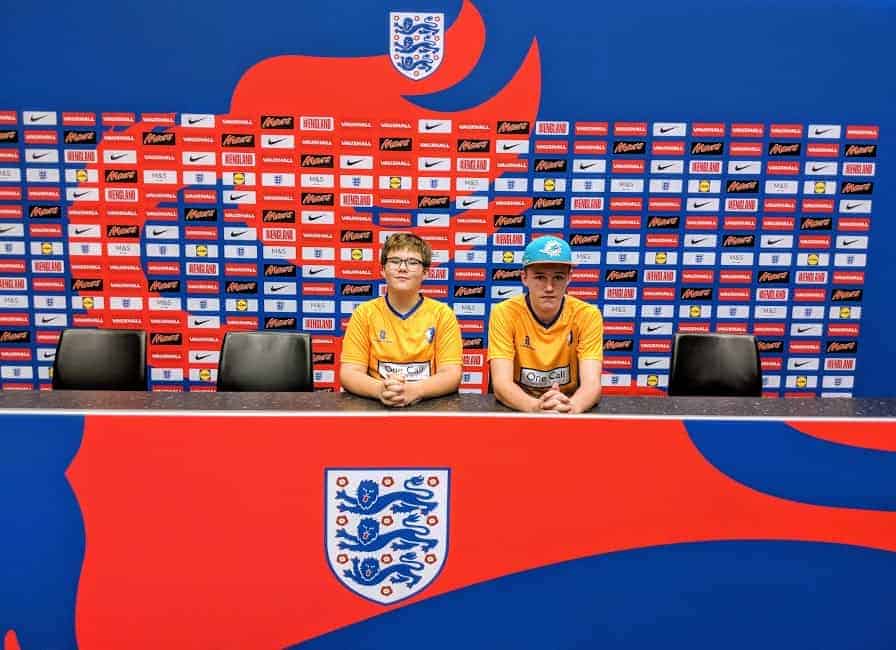 Two people sitting at the press conference desk at Wembley Stadium