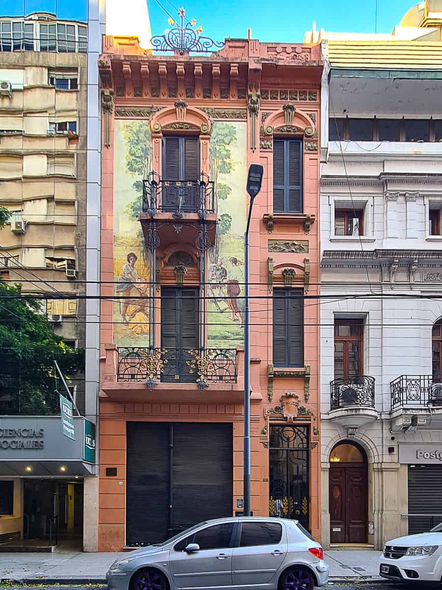 Unique facade of La Casa de los Azulejos in Buenos Aires, showcasing beautiful hand-painted tiles, intricate ironwork, and vibrant architectural details that make it a hidden gem in the city.