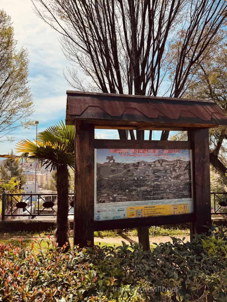 A wooden sign at the base of Mount Dajti where you take the Ekspres Cable Car. This is a must-do activity during your walking tour of Tirana.