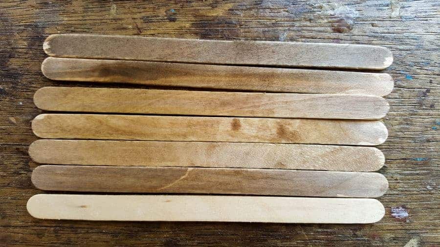 Stain the stirrers to give them that aged effect #FairyPottingBench #FairyDIYCrafts #ACraftyMix #FairyGardens #FairyCrafts #WhimsicalFairyCrafts #SimpleFairyCrafts #MiniaturePottingBench