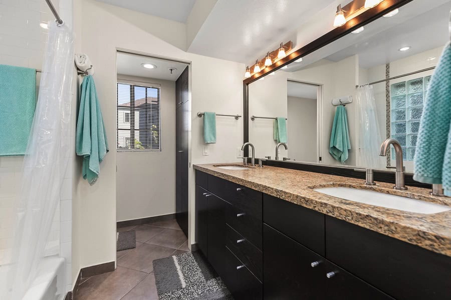 1950 Upas St Unit 308 - Bathroom Area with Contemporary Built-in Cabinets, Large Mirror, and a Granite Countertop