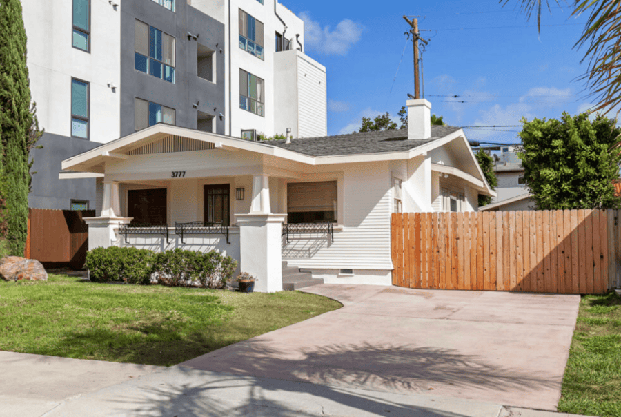 North Park San Diego home next to new apartments illustrating California housing changes for homeowners