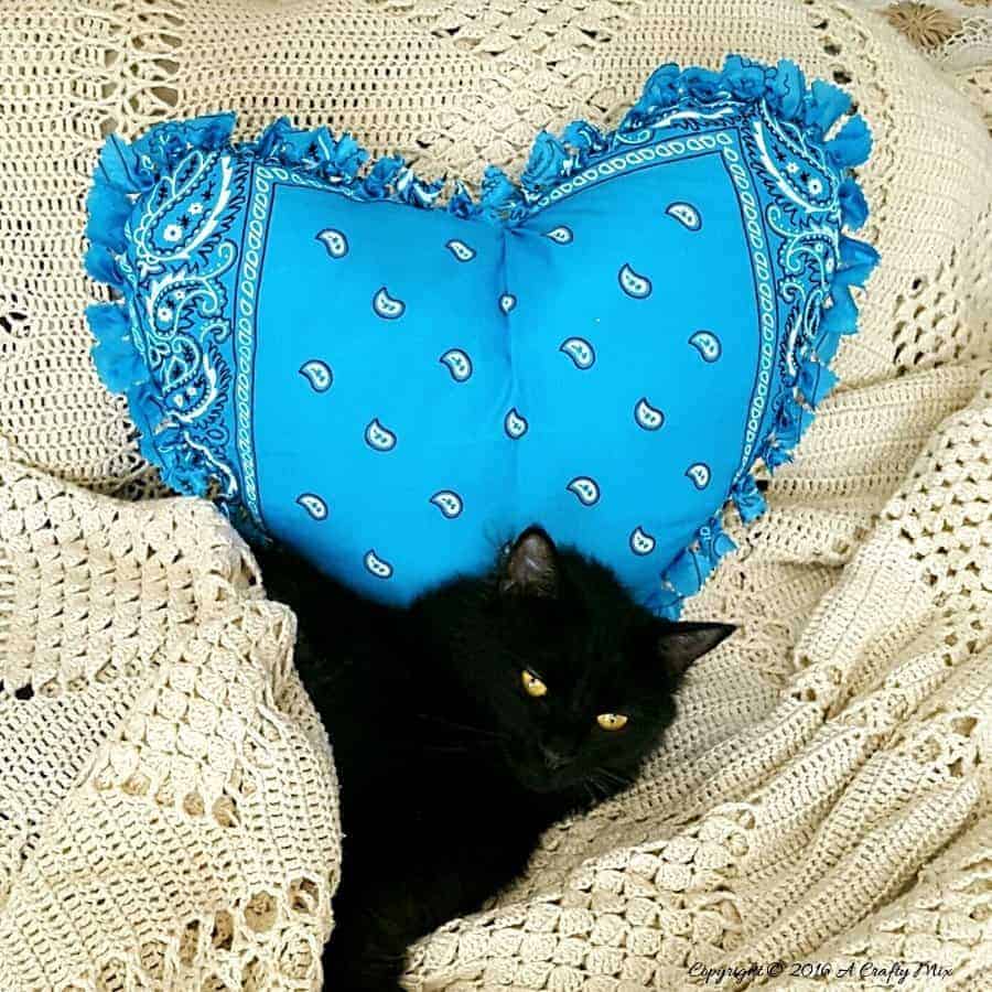 Make this easy no sew bandana heart pillow in less than 30 minutes. #NoSew #HeartPillow #ACraftyMix
