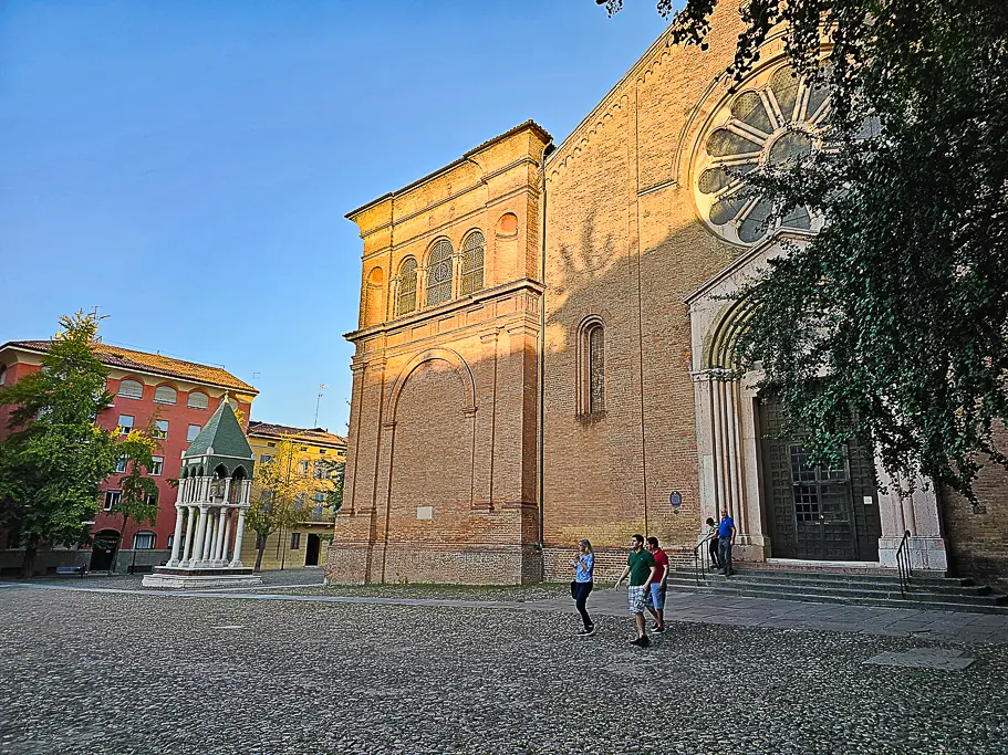 Exterior view of Basilica of San Domenico in Bologna, Italy, with golden hour light casting shadows—one of the most photogenic churches in Bologna for architecture and historic charm.