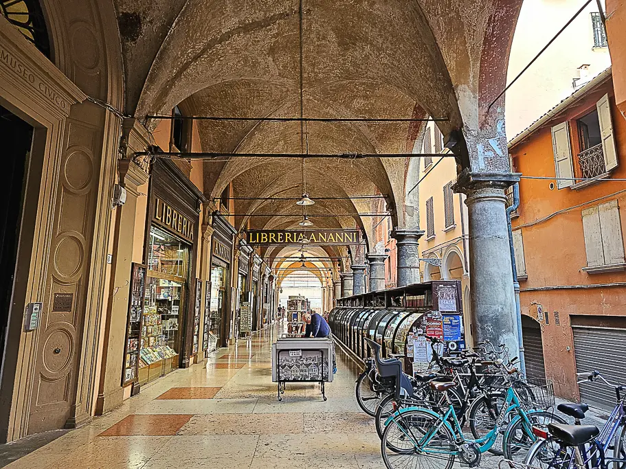 Libreria Nanni, a historic bookstore located under Bologna’s famous Portico dei Servi, with arched ceilings and classic signage—a charming place to capture Bologna’s literary heritage.