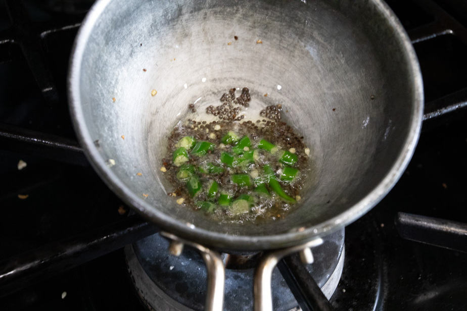 Tempering of chillies and mustard seeds in oil