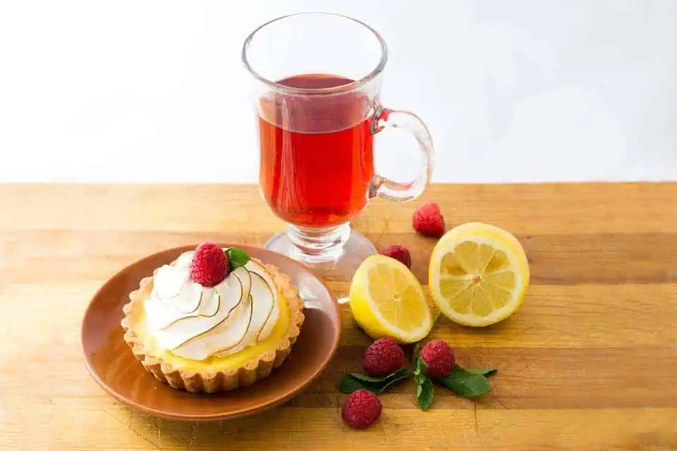 Tea and a tart on a table.