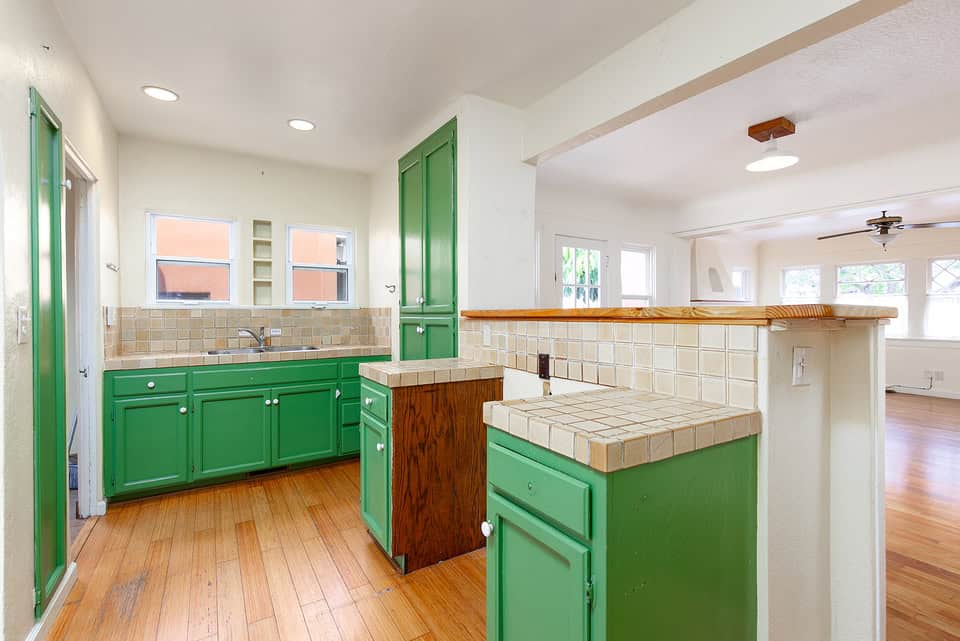 3530 Park Villa Drive - Another Kitchen Area Angle with a Brick Patterned Counter Top and Green Cabinet Storages
