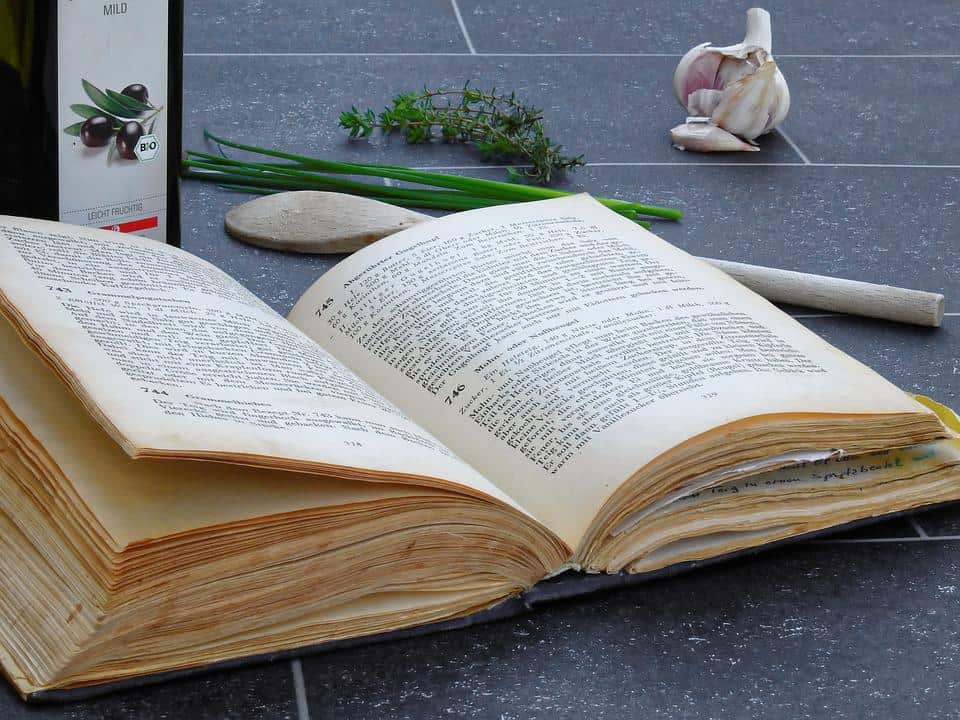 book with veggies on table.