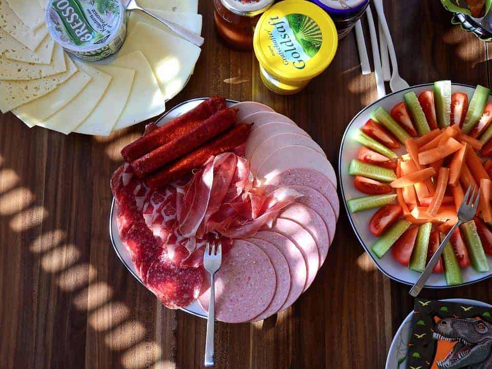 Different Polish meats on plates.