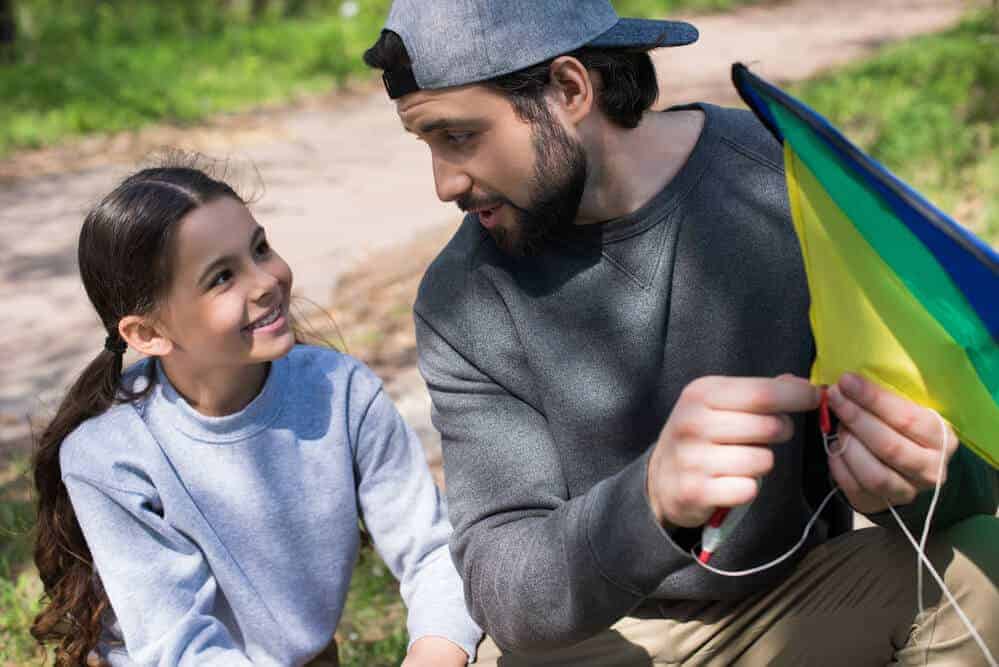 girl-and-dad-making-a-kite