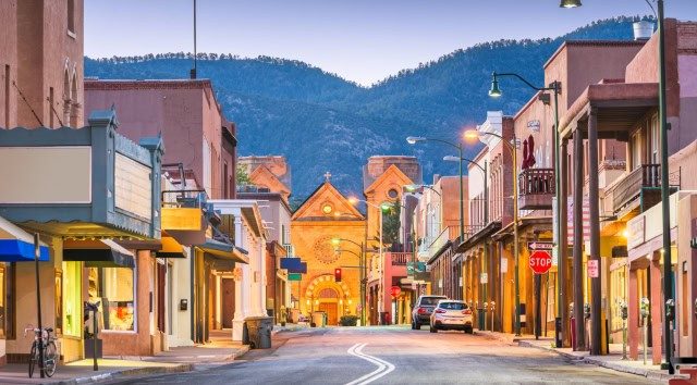 A street in Santa Fe, New Mexico, with the Cathedral Basilica of St. Francis of Assisi in the background.