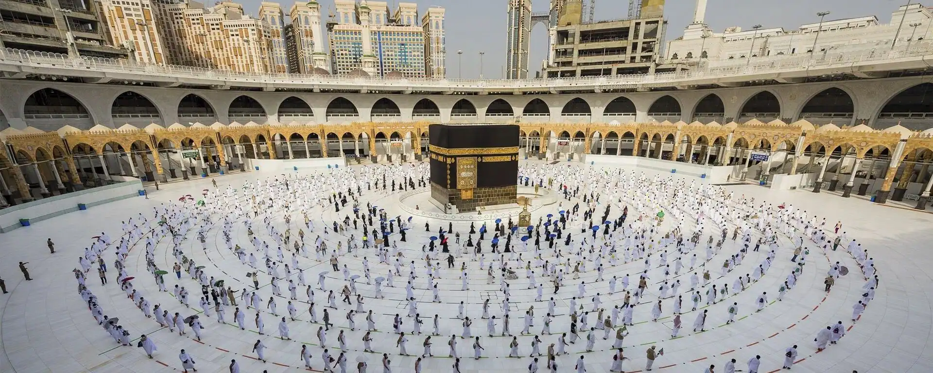 Night view of the Holy Kaaba surrounded by thousands of pilgrims performing Tawaf in Masjid al-Haram, Makkah