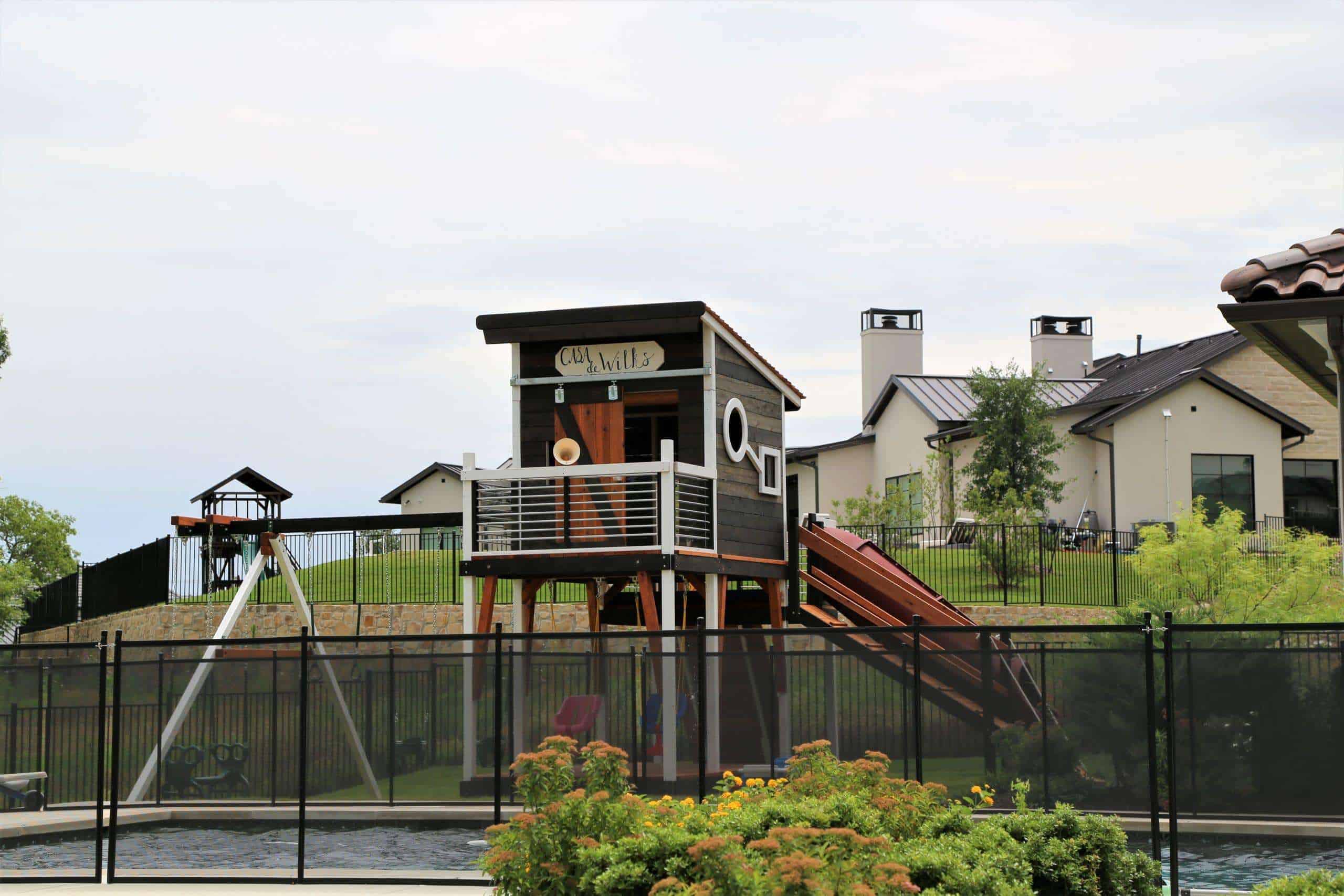 modern design swing set, dallas swingset, new swing sets, swing set accessories, swings, slide, and cabin with sliding barn door