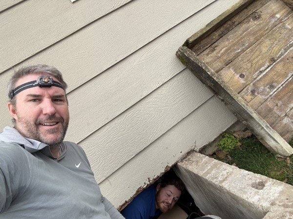 Kirk, owner of Barrier Pest Control, working alongside his team