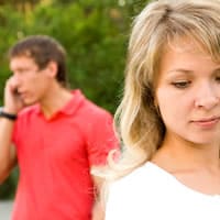 Guy ignores woman while using cell phone