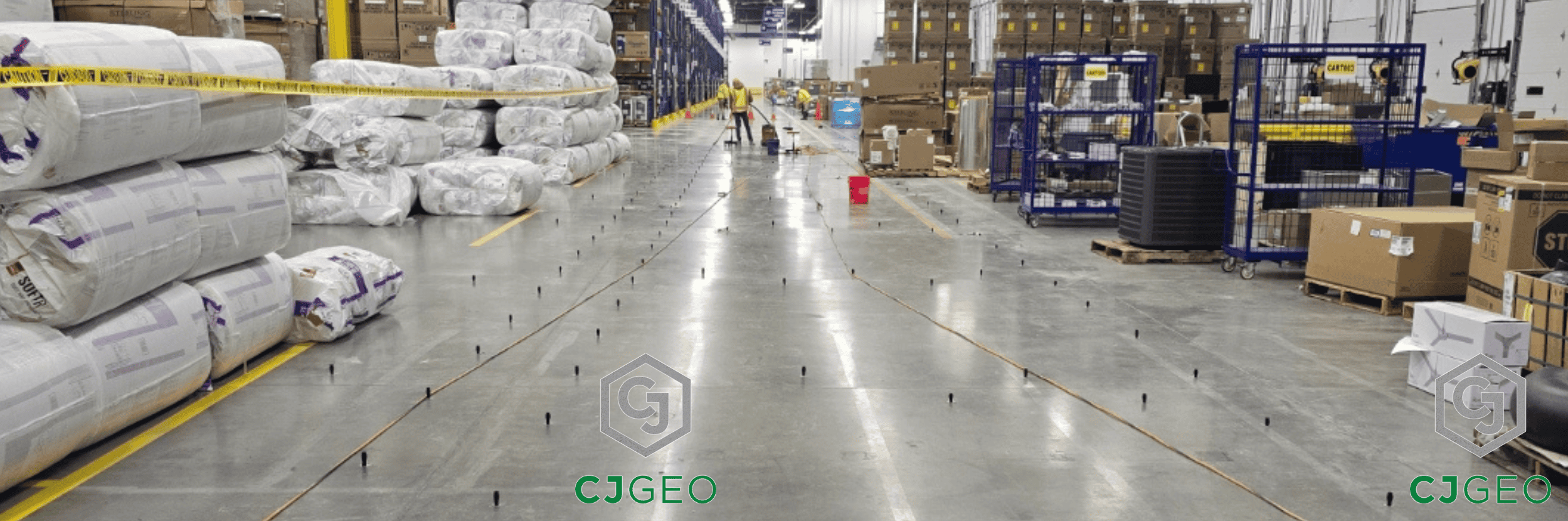 a large warehouse with people working on the floor