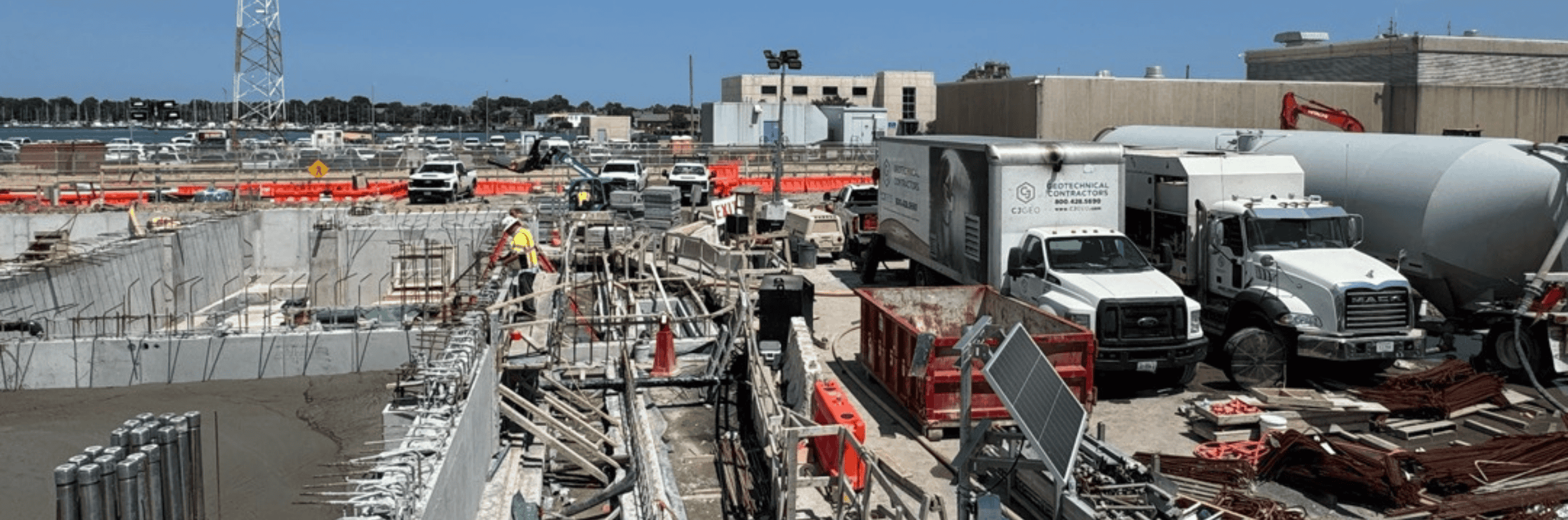 CJGeo cellular concrete batching equipment on a congested construction site.