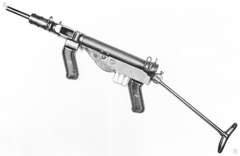 Left side view of the Austen Mk I with the buttstock extended and no magazine in place. In this illustration, the resemblance to the Sten MK II is obvious in the lower receiver area and the rear of the barrel. PHOTO CREDIT: US Army