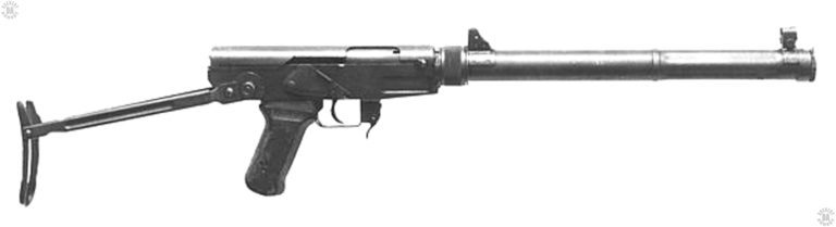 Right side view of the Chinese Type 64 suppressed submachinegun with the stock open. There is no magazine in the feed well and the safety switch is in the open/off position. The bolt is forward in the fired position. The tall protected front and rear sight assemblies stand out in their positions on top of the suppressor tube. PHOTO CREDIT: DIA